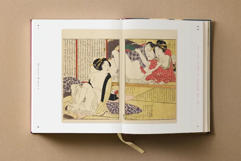 Open Hokusai Shunga art book showing intimate couple scene in woodblock print